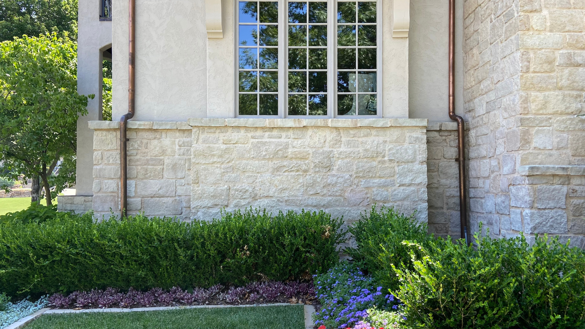 Exterior stone refresh using limewash, by Kirkendall Design