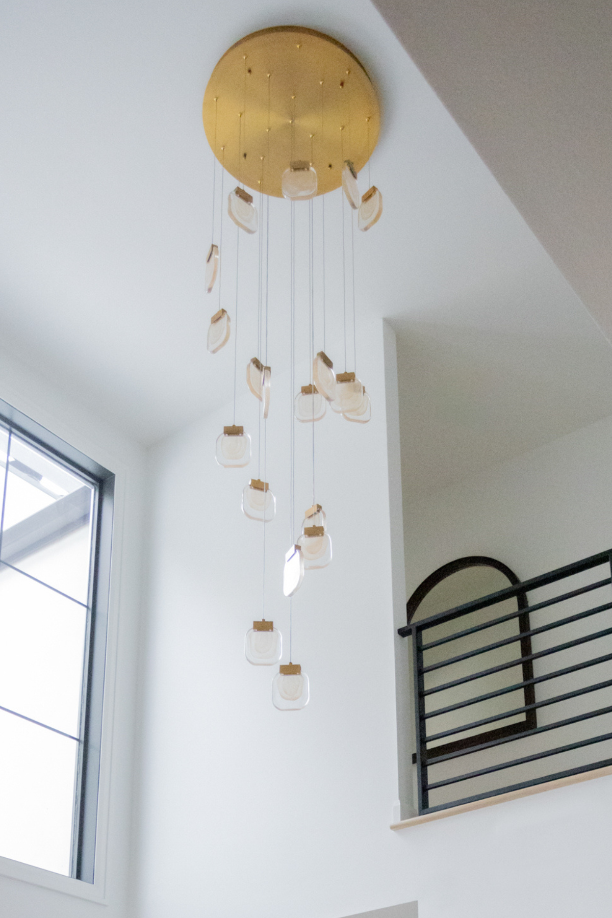 statement lighting in entryway by Kirkendall Design