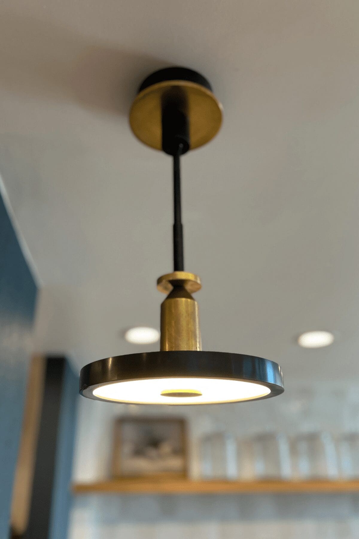 black and gold kitchen pendant in commercial kitchen in tulsa, interior design by Kirkendall Design