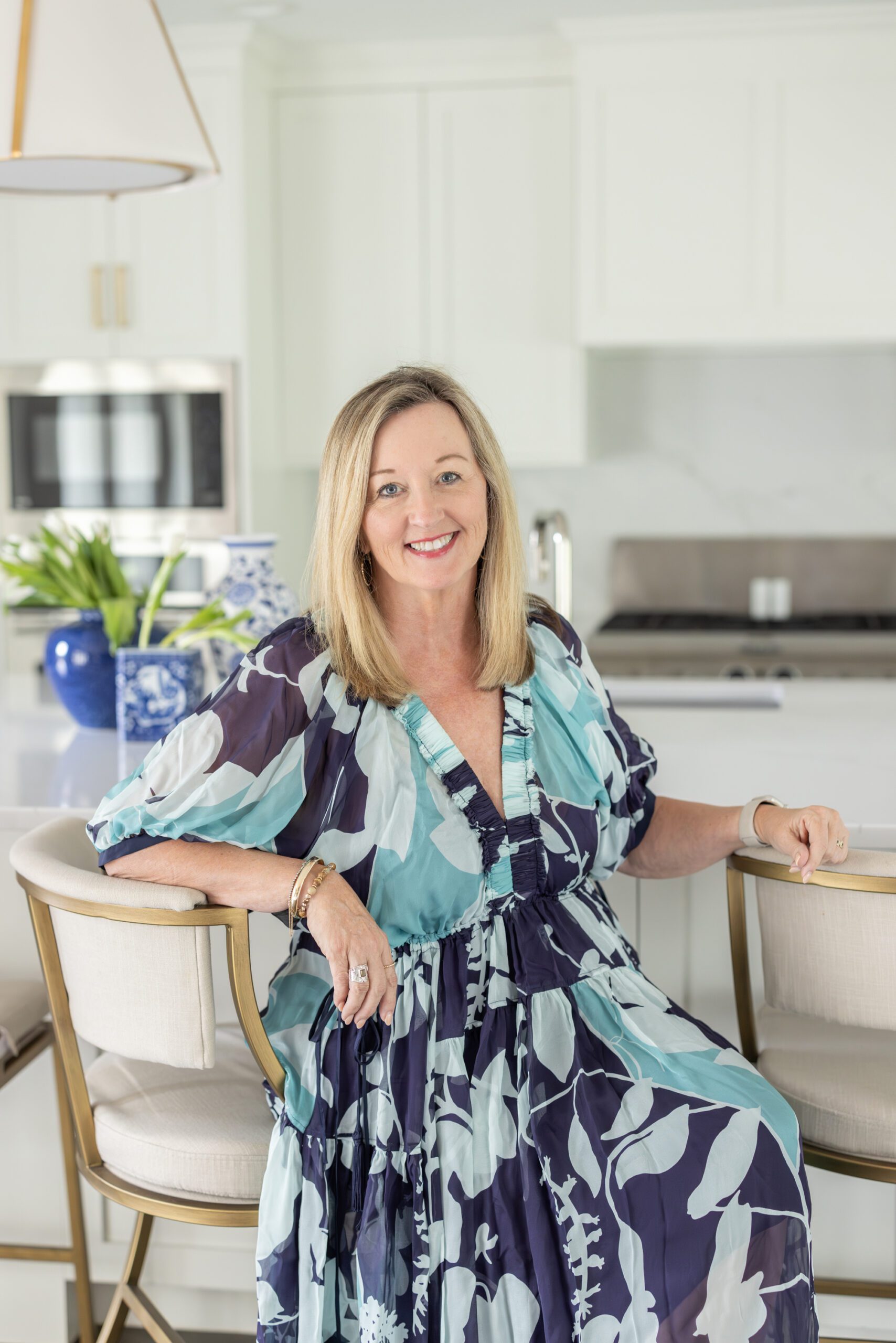 Our owner and principal designer, Julia Kirkendall, seated in an interior design kitchen project