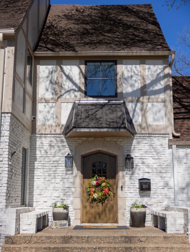 Exterior shot of 1930s renovation project in Tulsa OK by Kirkendall Design, full service interior design firm