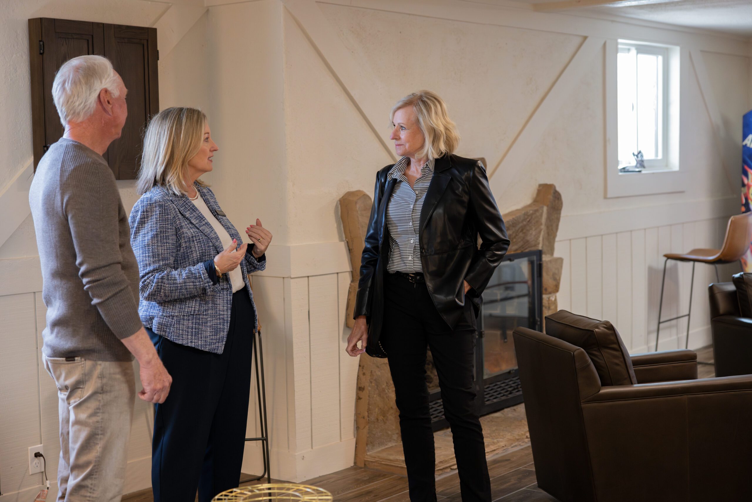 Julia Kirkendall talking with guest at Designer Spotlight event in 1930s home renovation in Tulsa OK by Kirkendall Design, full service interior design firm