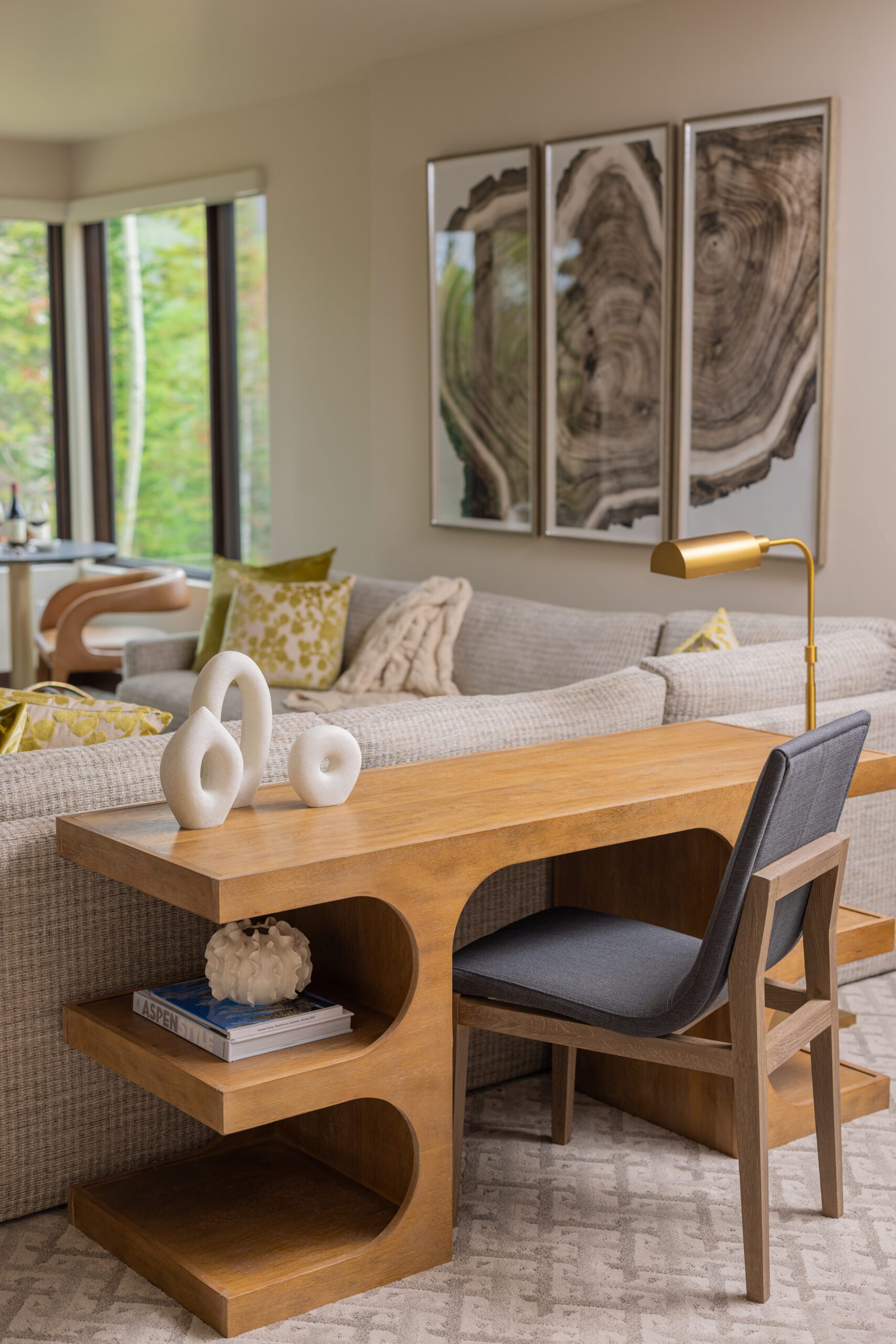 Desk in game room styled behind couch, luxury interior design by Kirkendall Design of Tulsa, OK