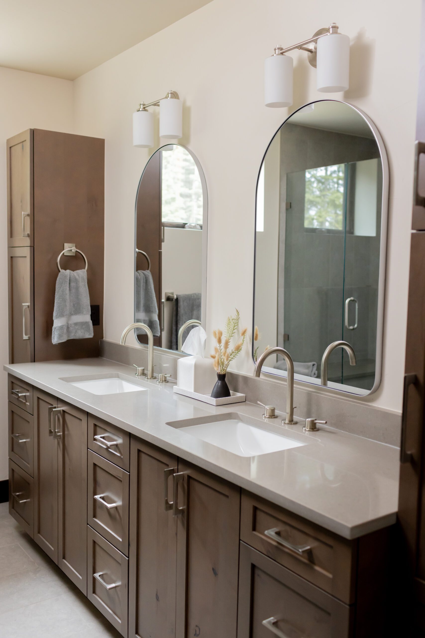 guest bathroom with Alder wood cabinets and quarts countertops in silverthorne home, luxury interior design by Kirkendall Design of Tulsa, OK