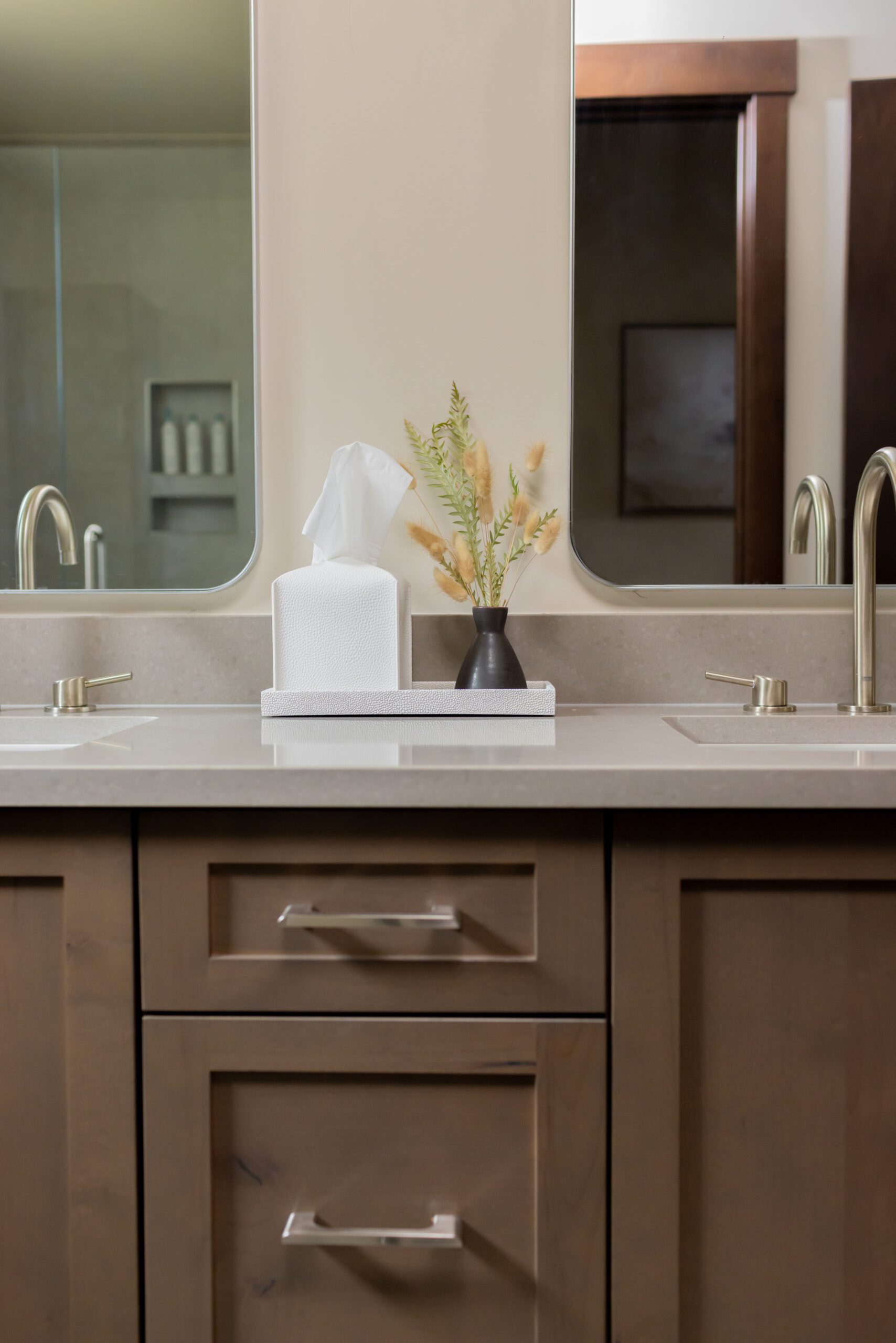 guest bathroom with Alder wood cabinets and quarts countertops in silverthorne home, luxury interior design by Kirkendall Design of Tulsa, OK