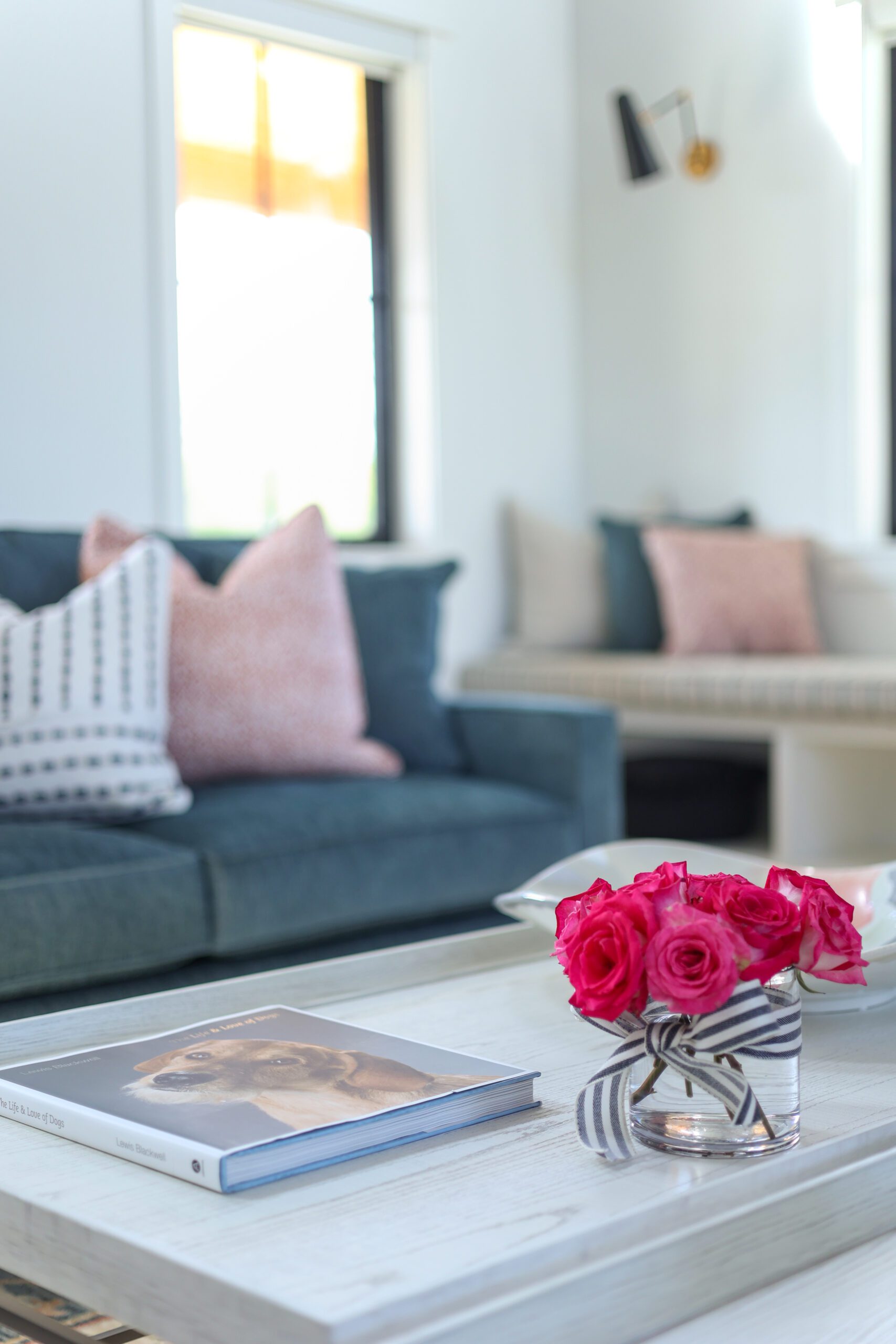 Blue couch with mix of patterned pillows, interior design by Kirkendall Design