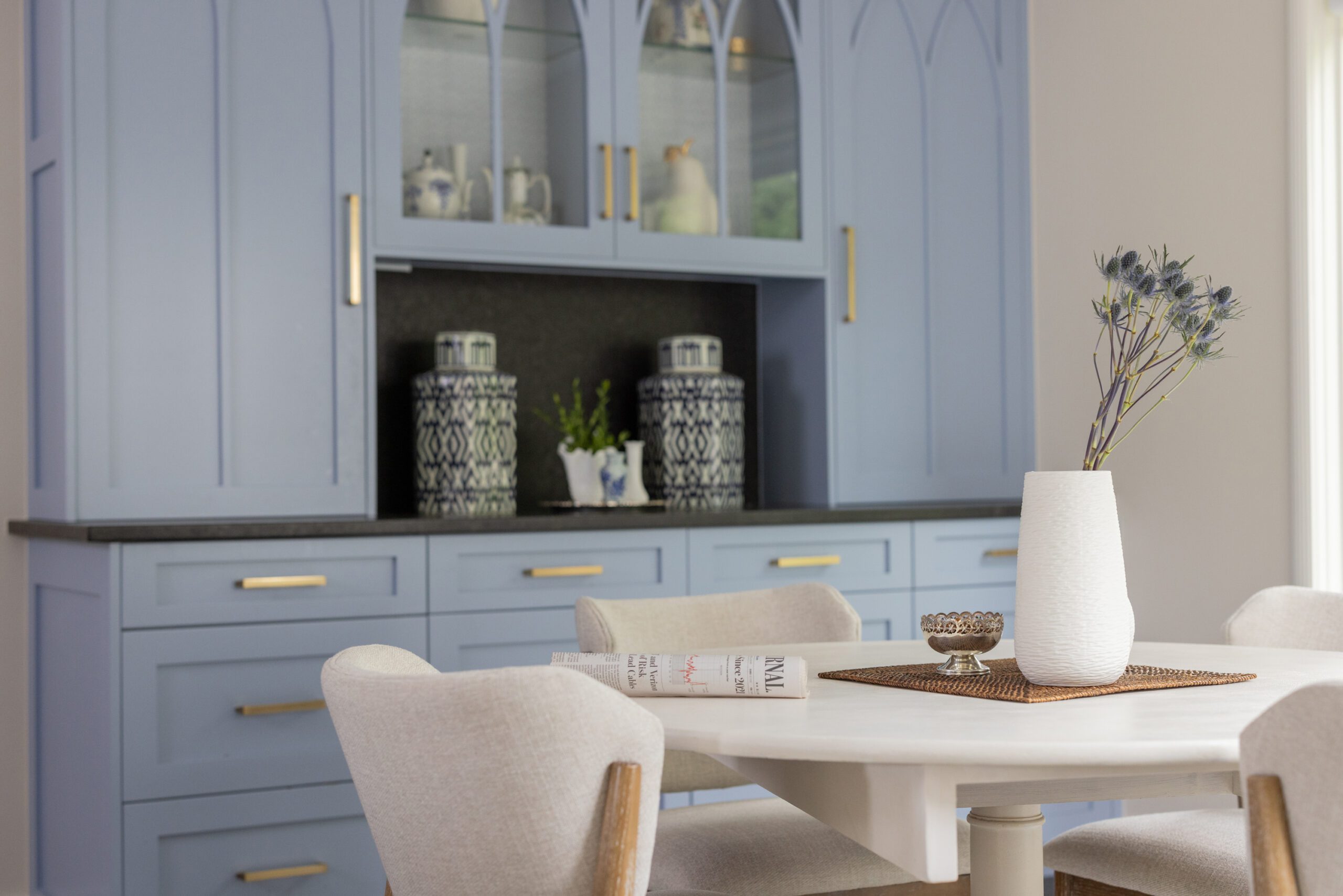 beautiful powder blue custom hutch in dining room, designed by Kirkendall Design in Tulsa