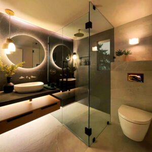 NKBA 2025 award-winning bathroom featuring custom floating vanity, zero-entry glass-walled shower, and in-wall toilet.