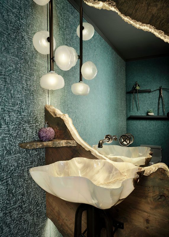 NKBA 2025 award-winning powder bath with custom quartz onyx sink and unconventional design elements inspired by the client's love for burled wood and gemstones