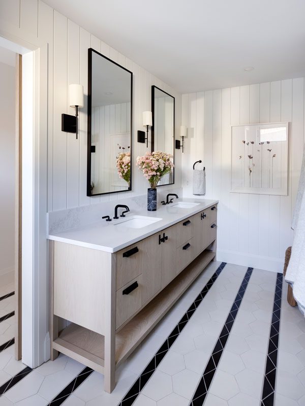 NKBA 2025 award-winning bathroom featuring a black and white motif with a distinct tile design.