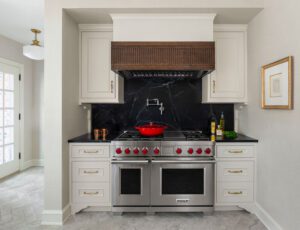 A Wolf range surrounded by cabinets in a traditional kitchen