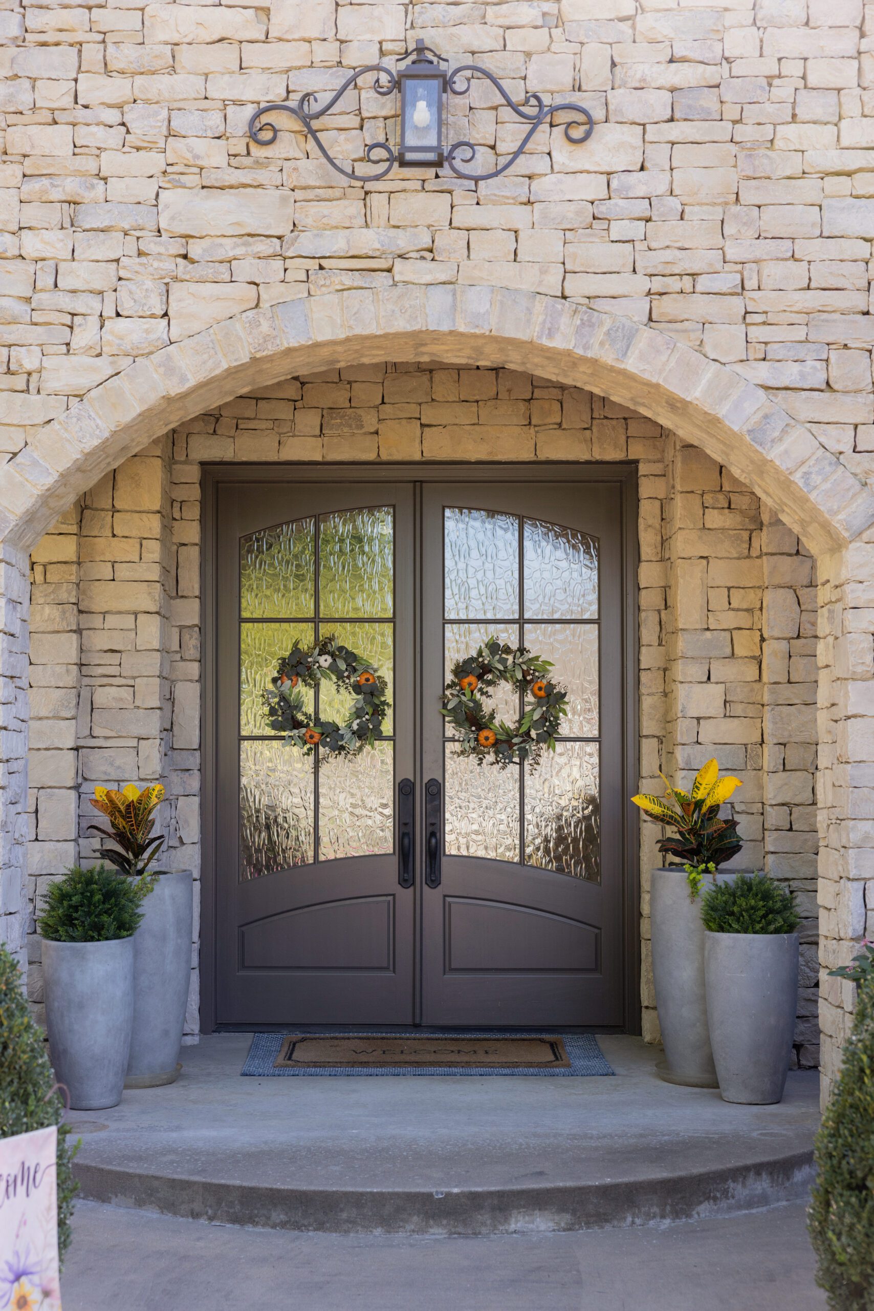 Front entrance of Tulsa home with refreshed limewashed stone