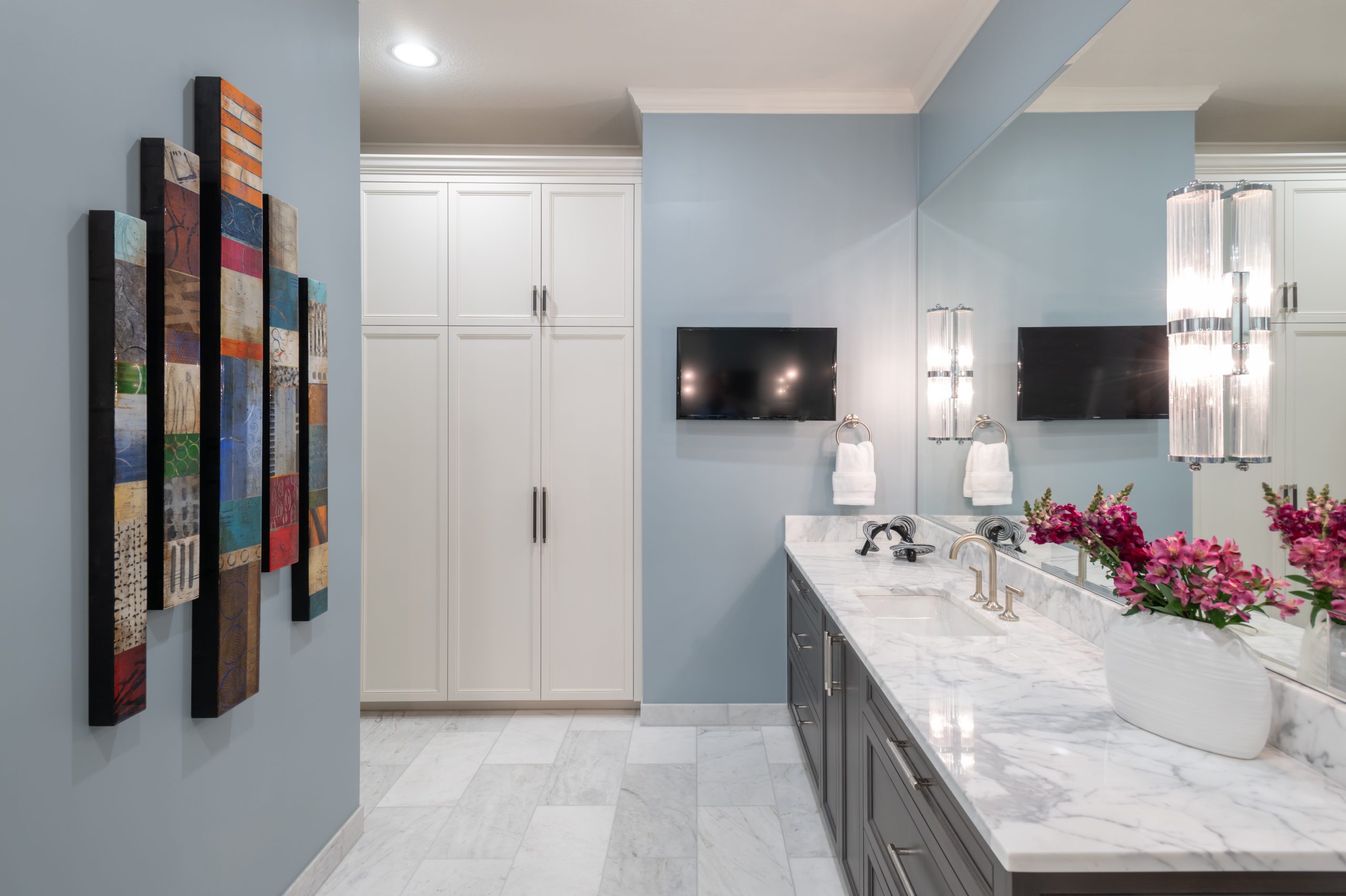 Luxury primary bathroom renovation designed by Kirkendall Design featuring marble flooring, a freestanding soaking tub, walk-in shower, and timeless spa-inspired finishes in this Tulsa multigenerational home.