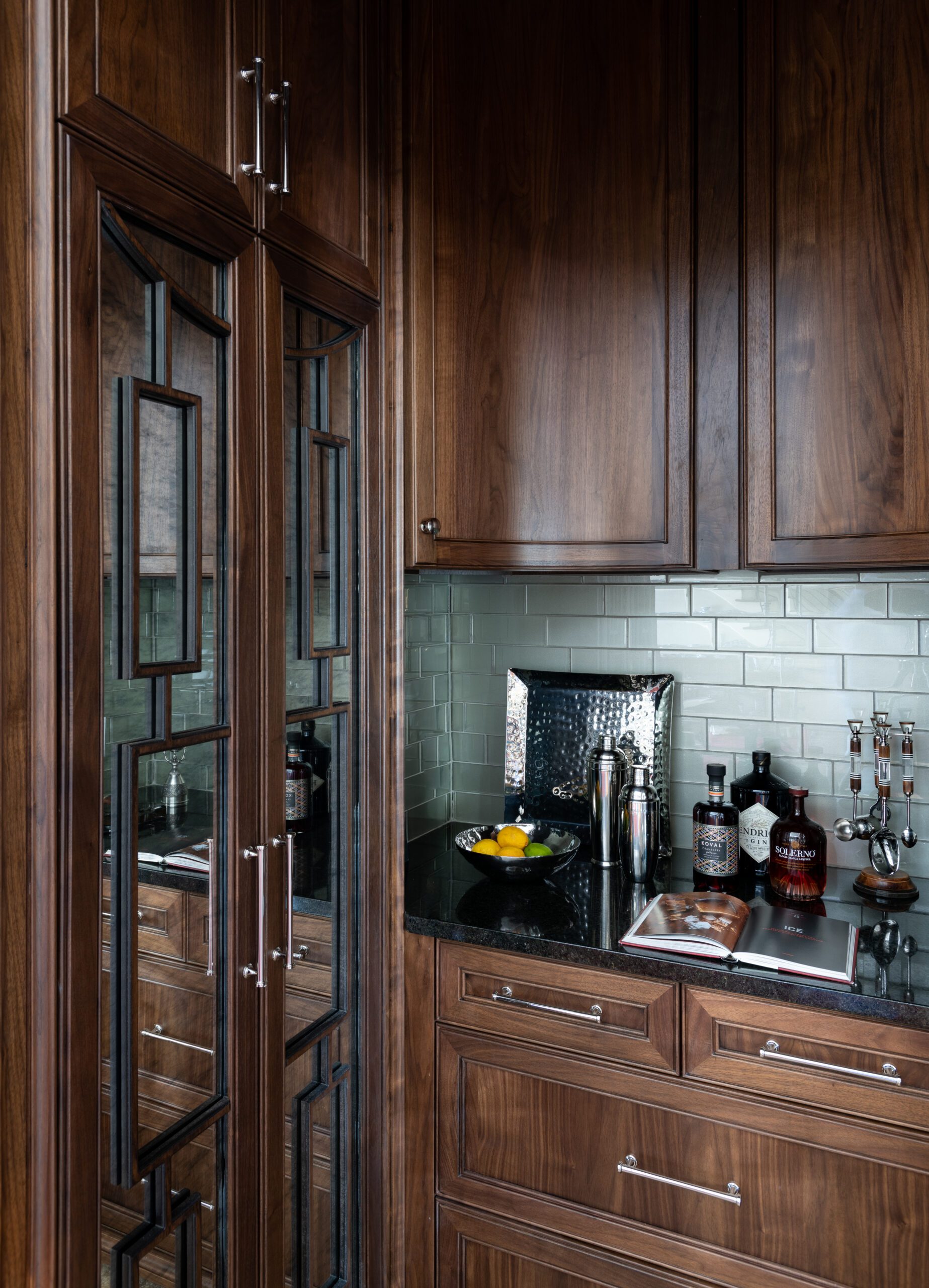 Butler’s pantry designed by Kirkendall Design featuring custom curved cabinetry, warm wood tones, and tailored storage solutions in this luxury multigenerational Tulsa home.