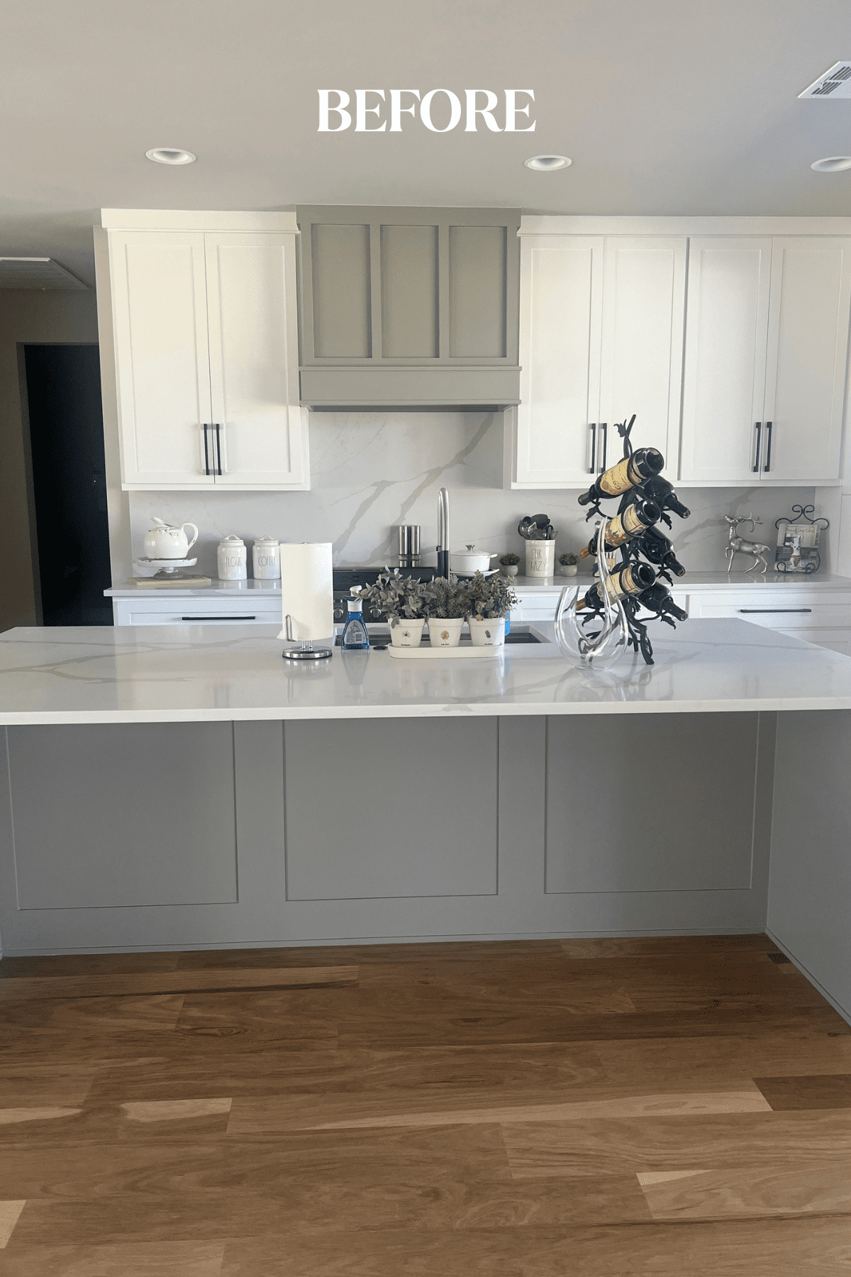 Before photo of a Tulsa new construction home kitchen featuring an all-white and gray palette, builder-selected finishes, and a space ready for personalized interior design updates by Kirkendall Design